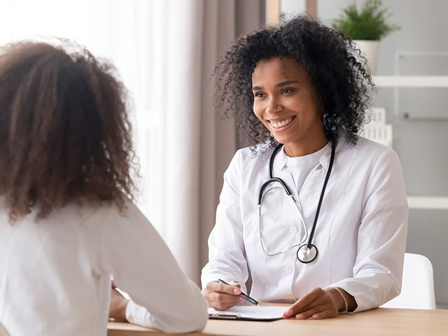 Therapist meeting with patients going over medical records