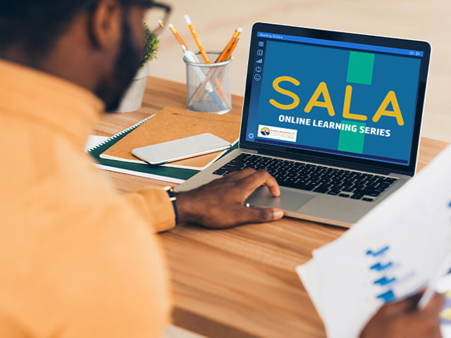 Man watching the SALA learning module on laptop