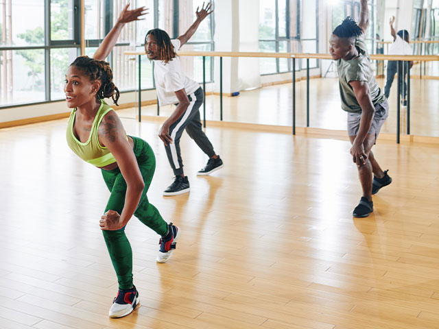 Dance teacher leading dance class