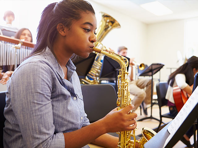 Student playing saxophone